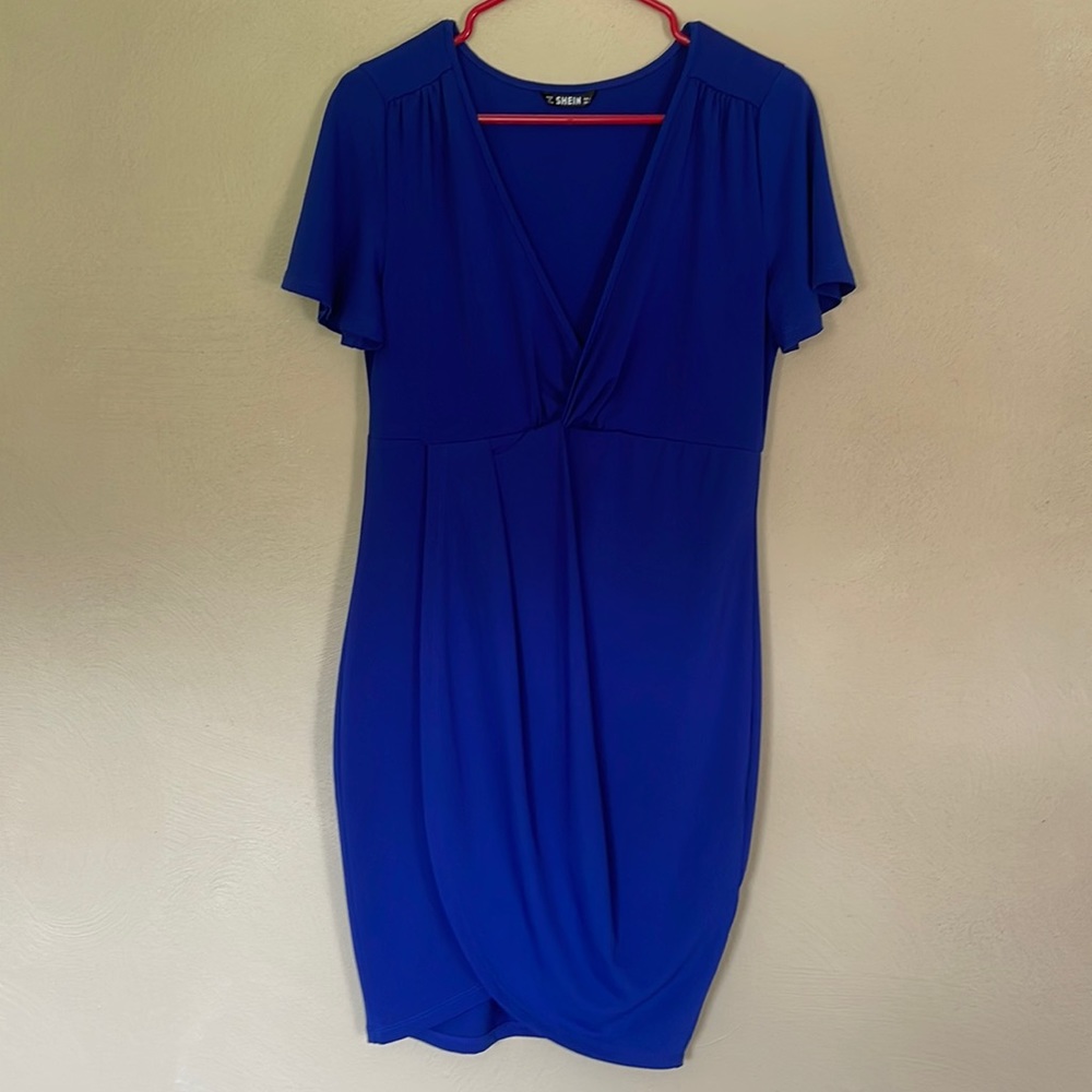 Deep blue, fitted dress. Deep V neckline